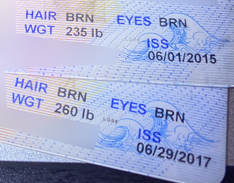 Detail of two driver licenses showing weight and issue date.