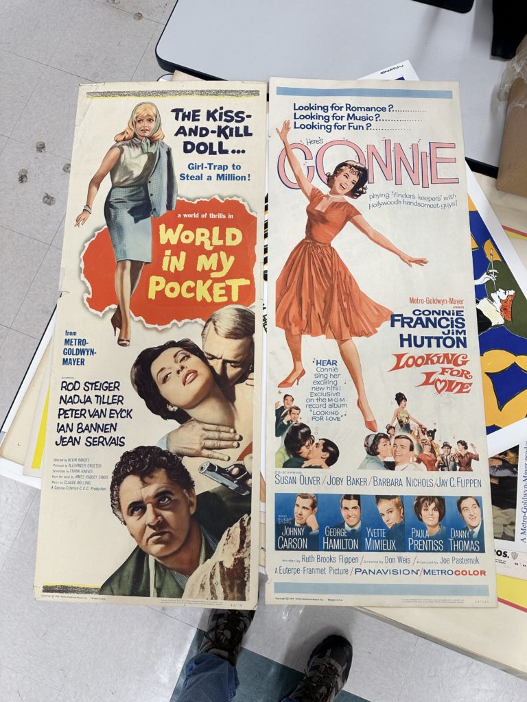 Posters for "World in my Pocket" and "Looking for Love"