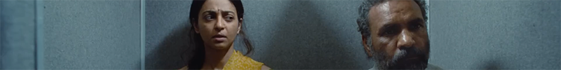 The faces of two people (Radhika Apte and Subhash Chandra) in an elevator in Sister Midnight.