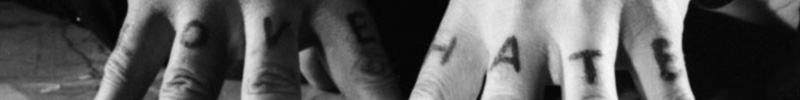 A closeup of Robert Mitchum's fingers in The Day of the Hunter, showing tattoos that spell LOVE on his right hand and HATE on his left.