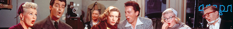 The cast of How to Marry a Millionaire sitting at a diner counter, singing.
