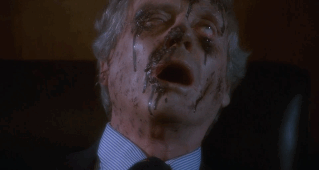 Mel Ferrer covered with wounds (or possibly bird poop) in The Visitor.
