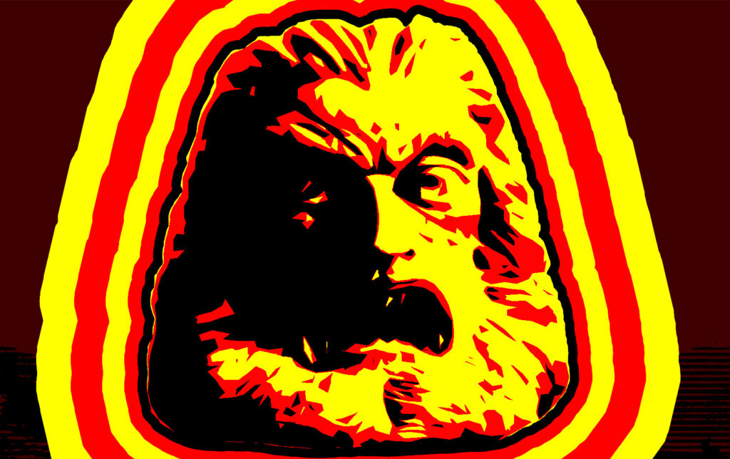 The giant stone head of Zardoz in red, yellow, and black.